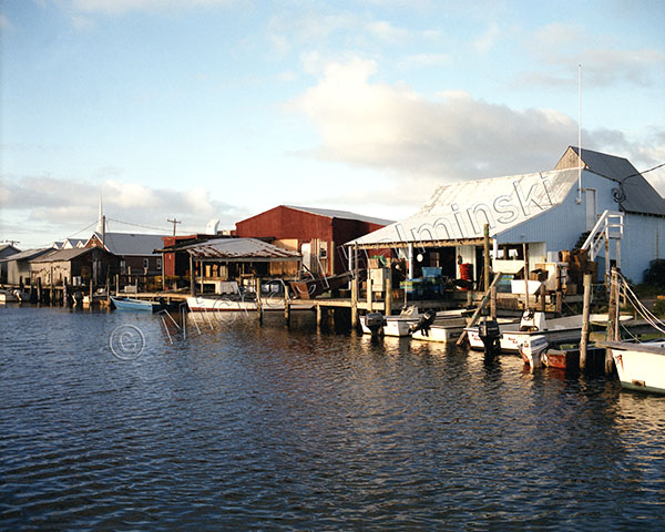 Pile of commercial fishing nets, with white floats, on the quayside Stock  Photo by Mint_Images